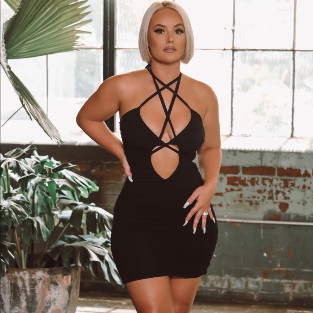 All mine mini dress clinches to curves tie can be adjusted & styled any way NWT